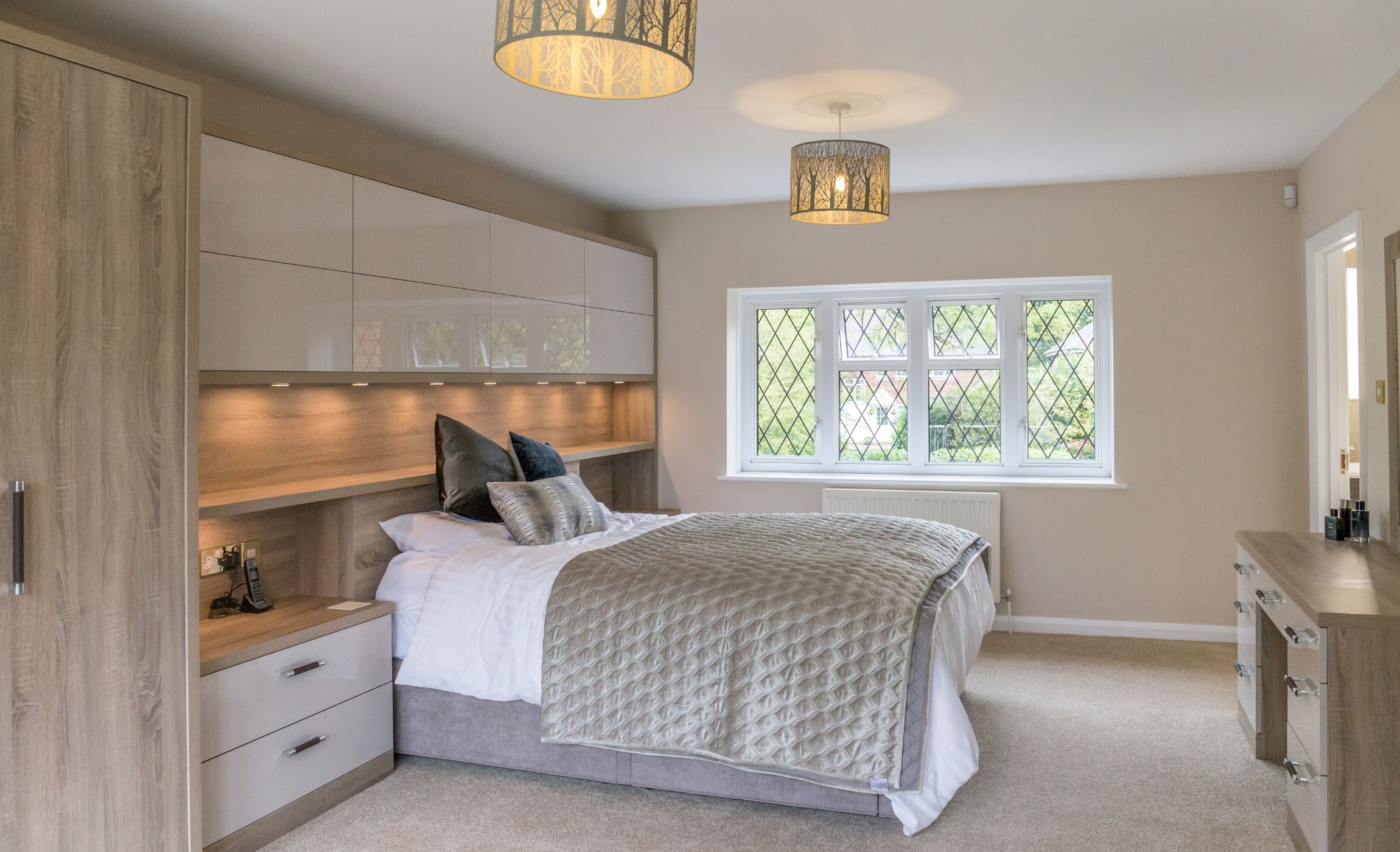 Bedroom with gloss cupboards