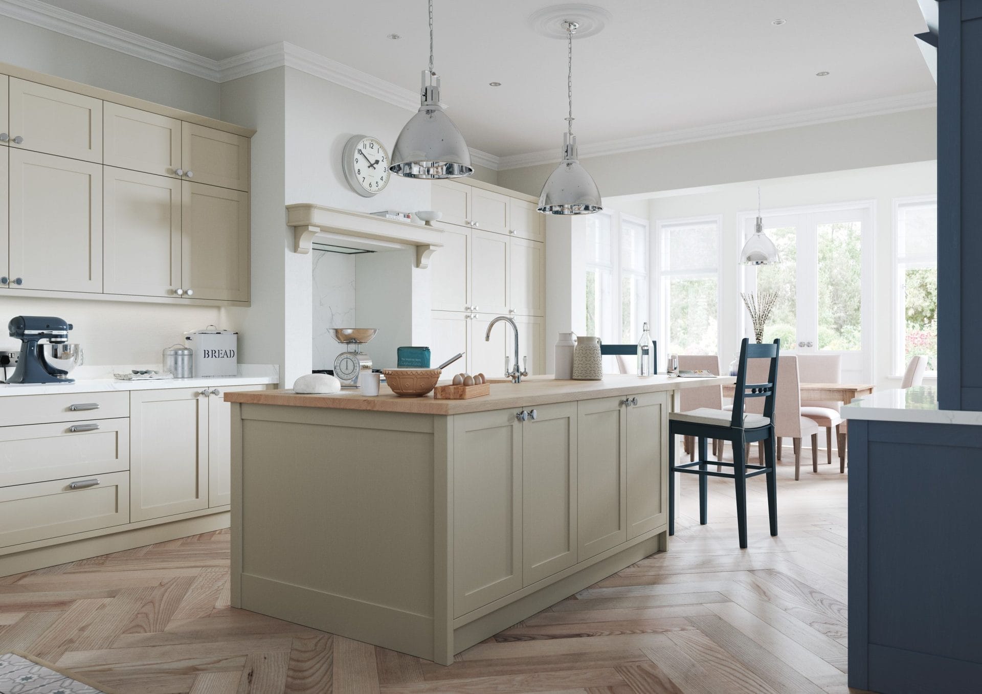 Sage green kitchen island with oak worktop and herringbone flooring