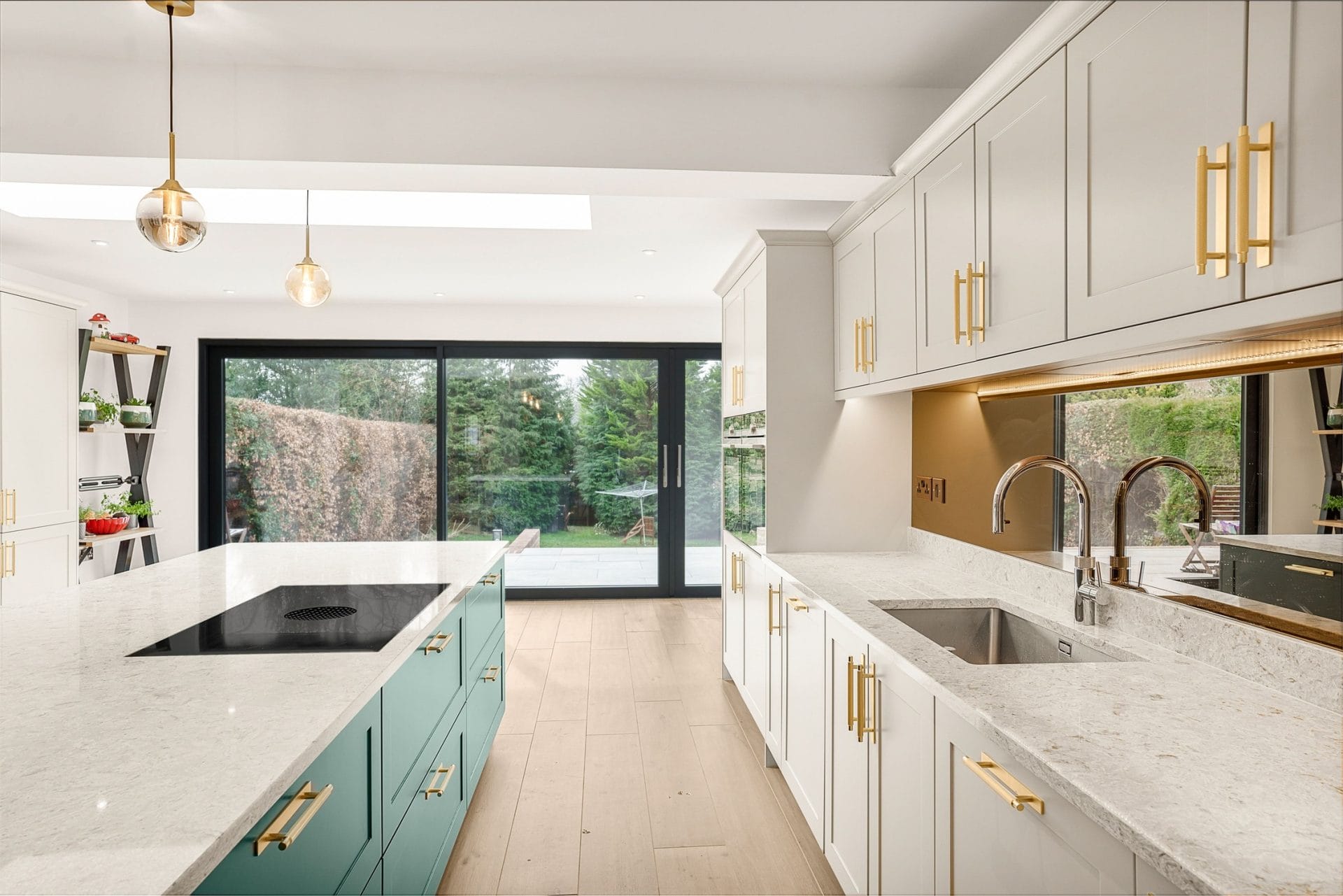 Quartz kitchen worktop with induction hob and sage island, bifold doors to garden