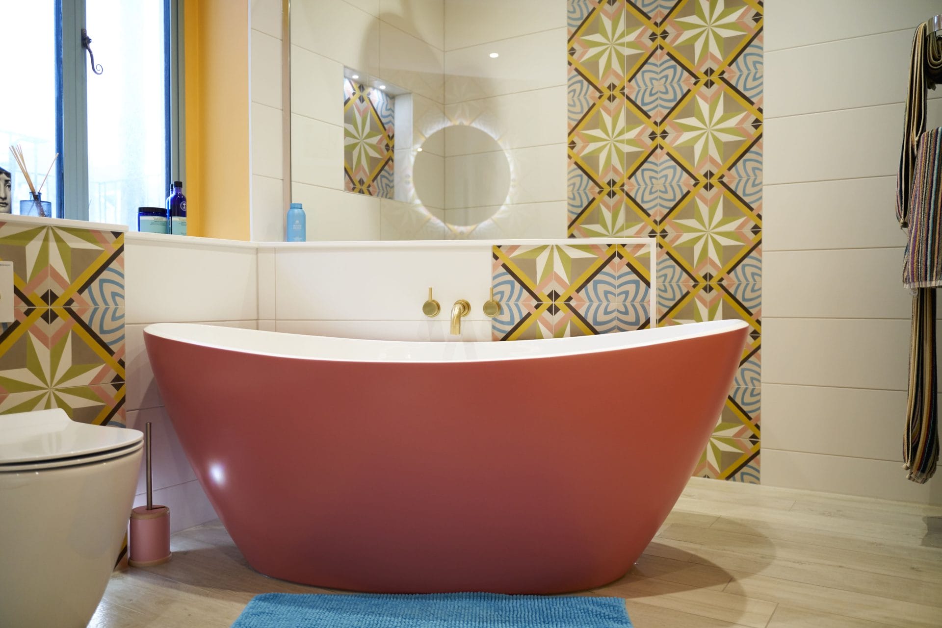 Terracotta freestanding bath with patterned feature tiles in a Sussex bathroom renovation
